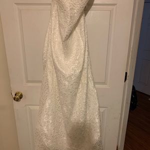 Ivory wedding dress never been worn still has tag.